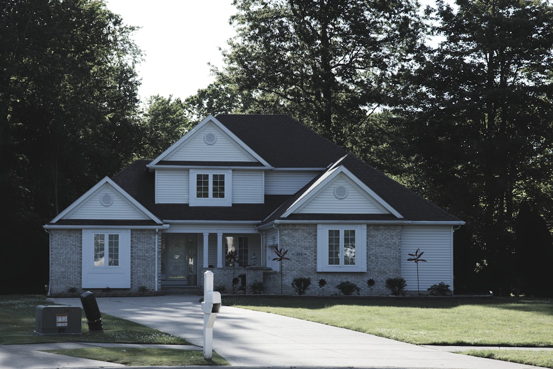 Suburban home with a freshly cleaned concrete driveway